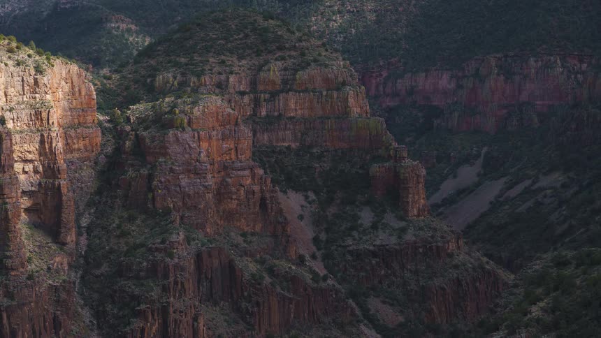 Cloud shadows move over a canyon