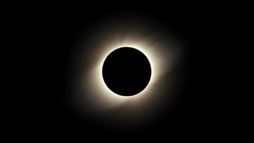 The moon fully eclipses the sun