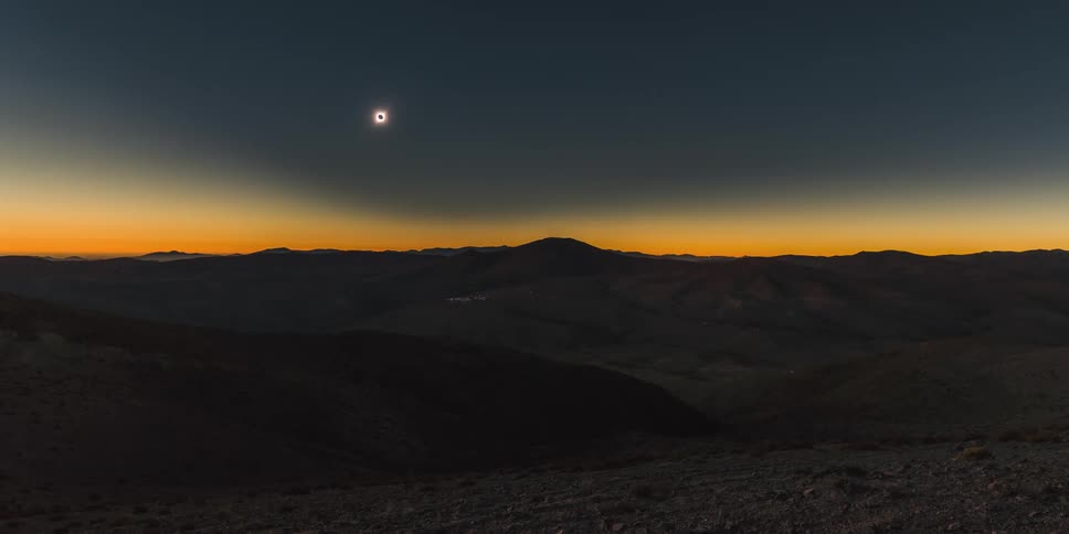 The moon casting a dark shadow on the earth during a total solar eclipse