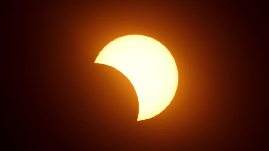 A solar eclipse is slowly taking place