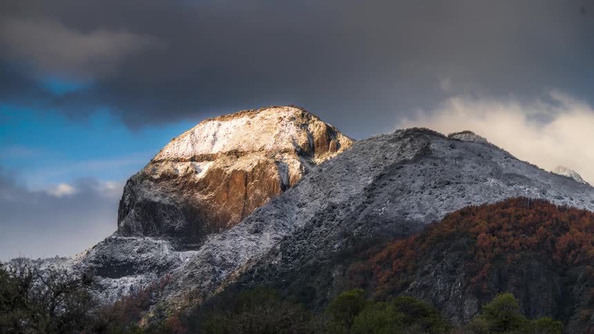 A mountain covered in snow during the day