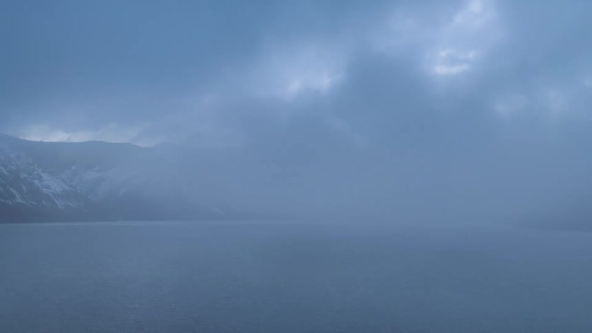 The clouds touch the lake on the mountains