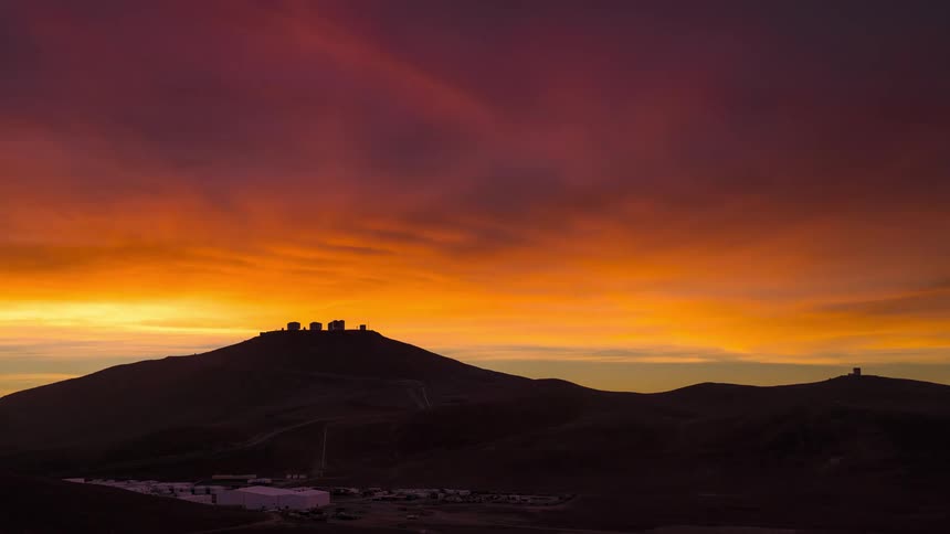 colorful clouds during sunset over an astronomical observatory