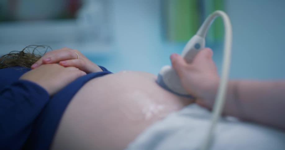A pregnant woman getting an ultra scan in the hospital