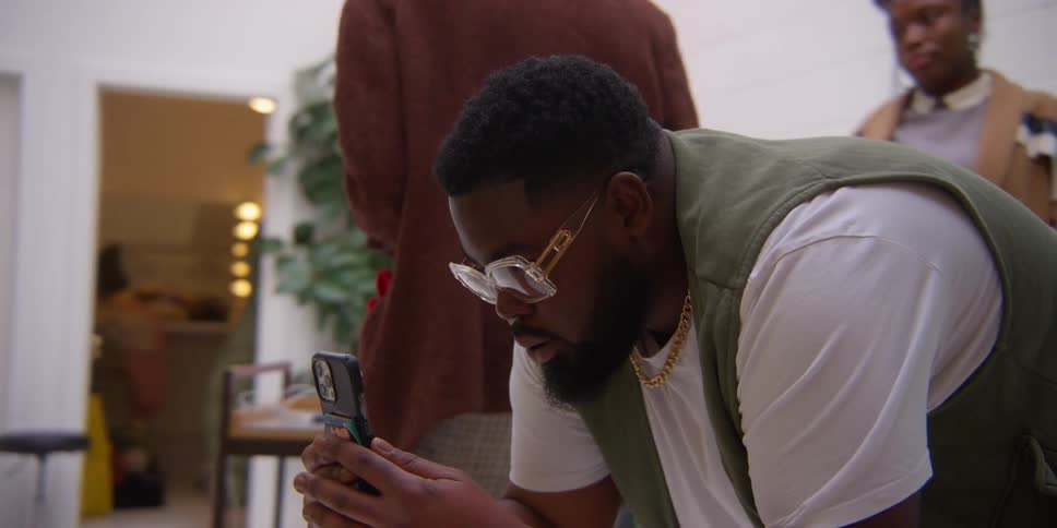 Men take photographs with their camera and cell phone