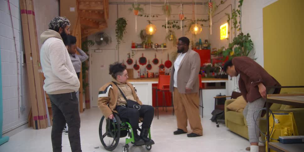 A group of people talking in a room