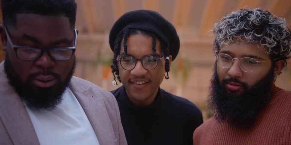 Closeup of young peoples faces watching something