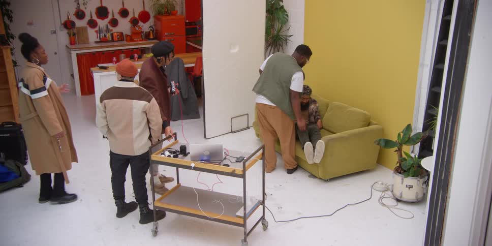 A group of models is preparing for the photo shoot in the studio