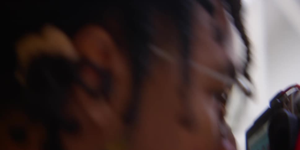 Closeup of a mans face taking photos with a professional camera