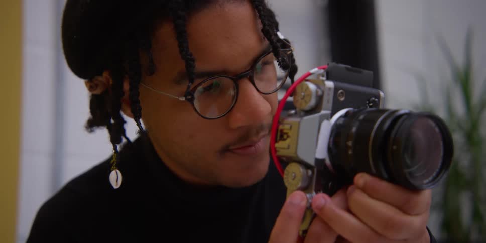 A man is taking photographs with his camera