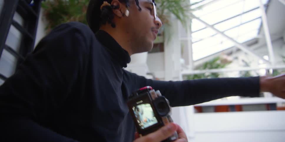 A photographer busy on a photo shoot at home