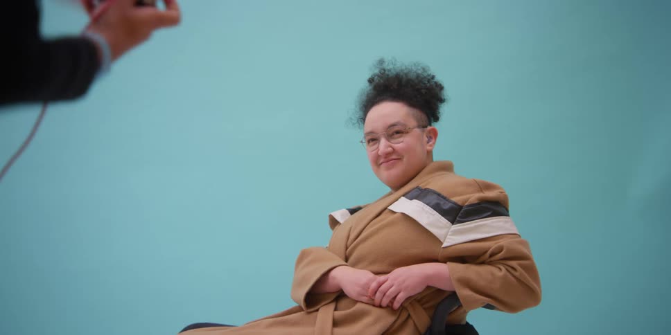 A model poses and gets photo taken