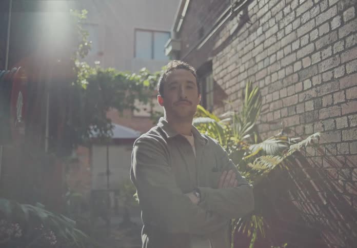 A man is standing in the alley