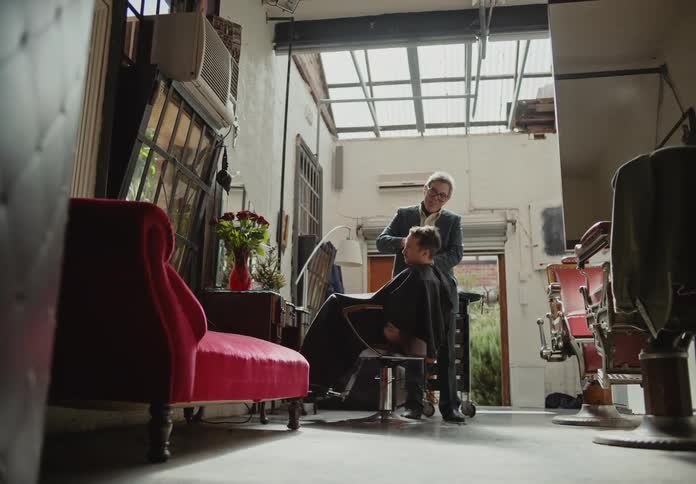 Barber giving a man a cut