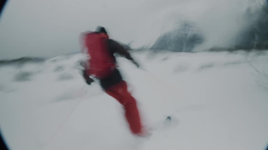 A man is skiing in the snow