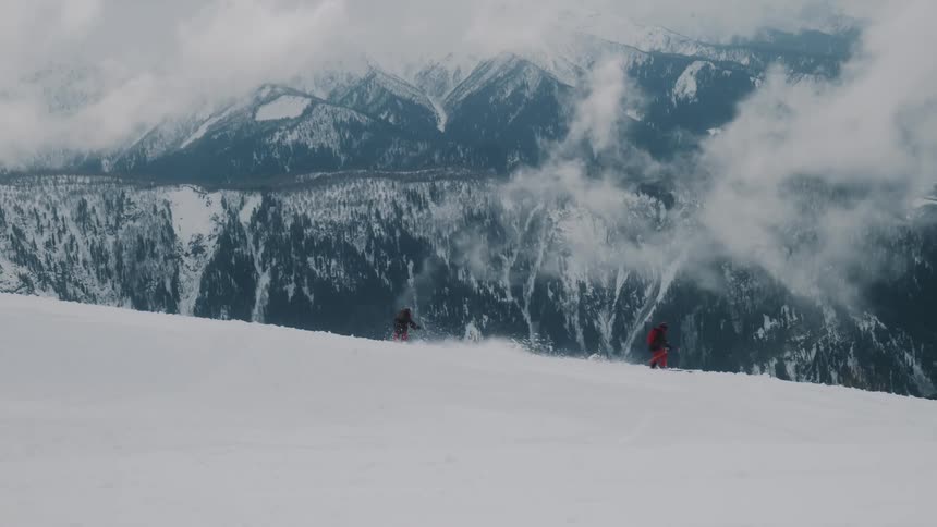 Two people are skiing in the snow