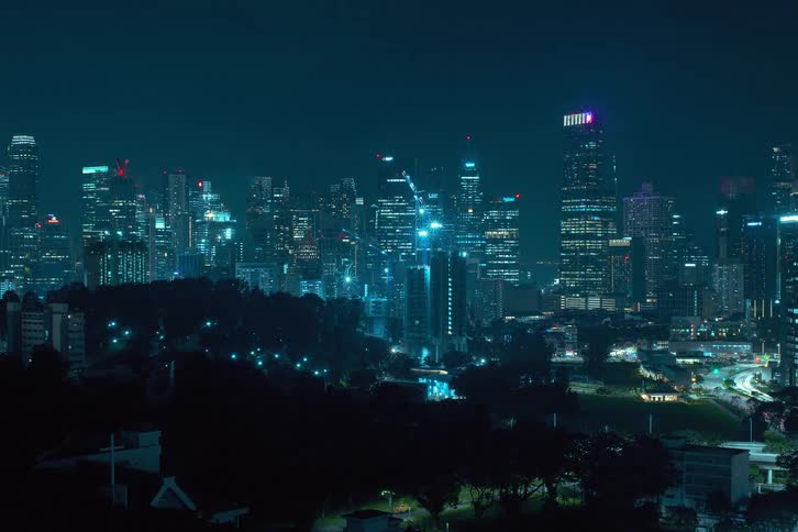 Time lapse of skyscrapers being built in the city at night
