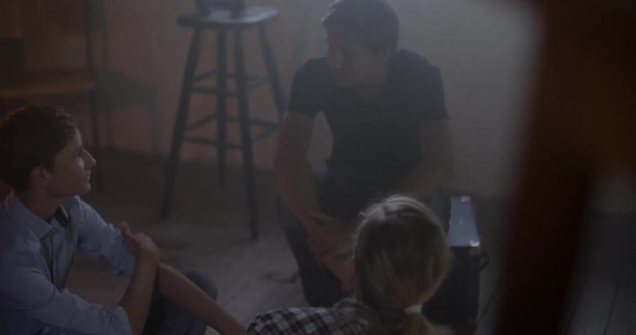 A group of people talking in a workshop