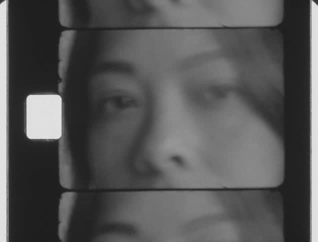 A young teenage girl stares pensively