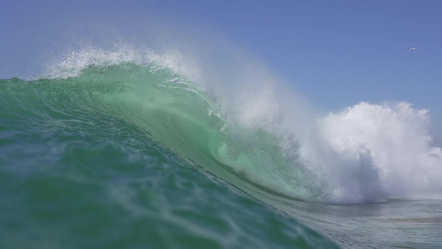 A wave with the crest breaking on its surface