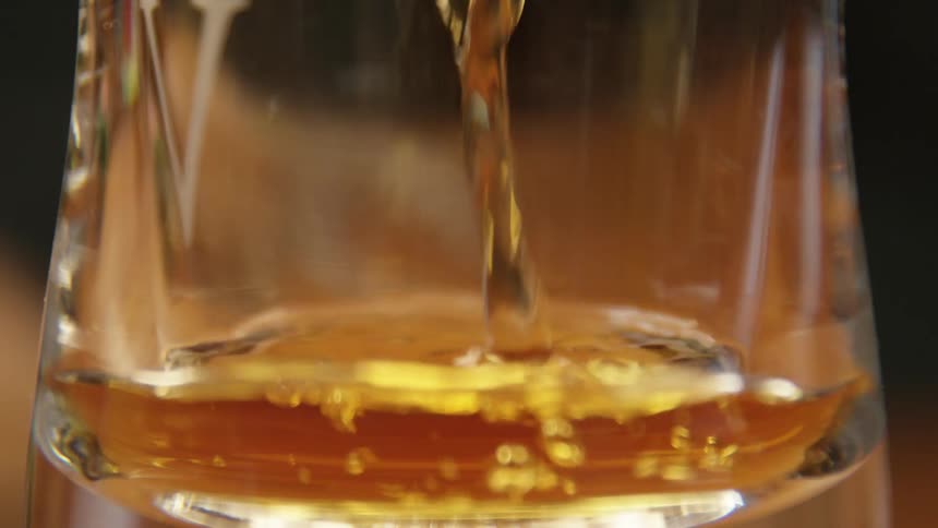 Alcohol pouring into a glass
