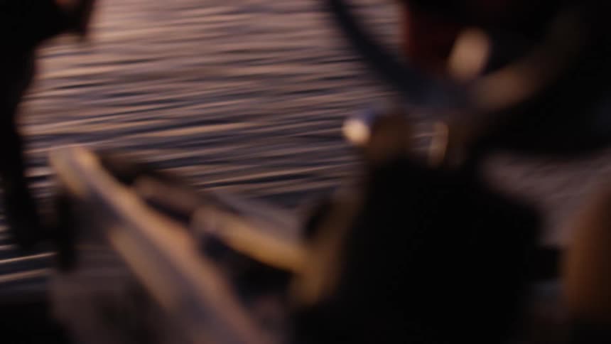Closeup on a boat engine moving through the sea one morning