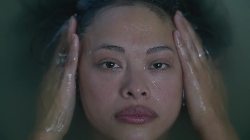 A woman is taking a bath