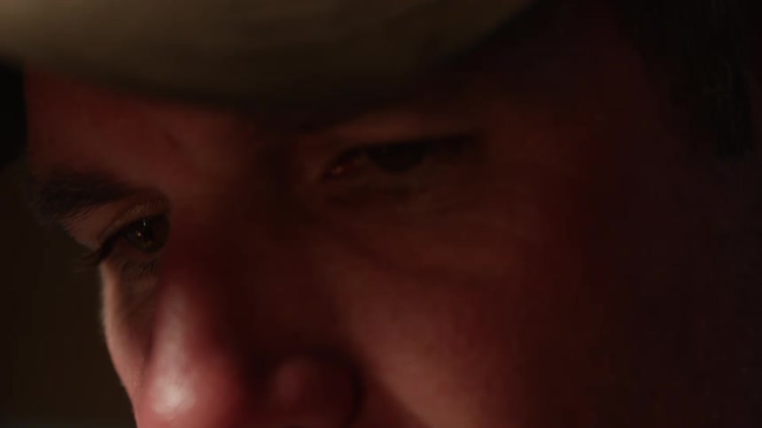 A face of a man with his eyes fixed on something