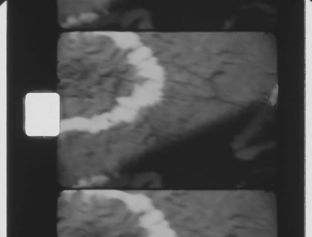 Black and white footage of a cloth on a table