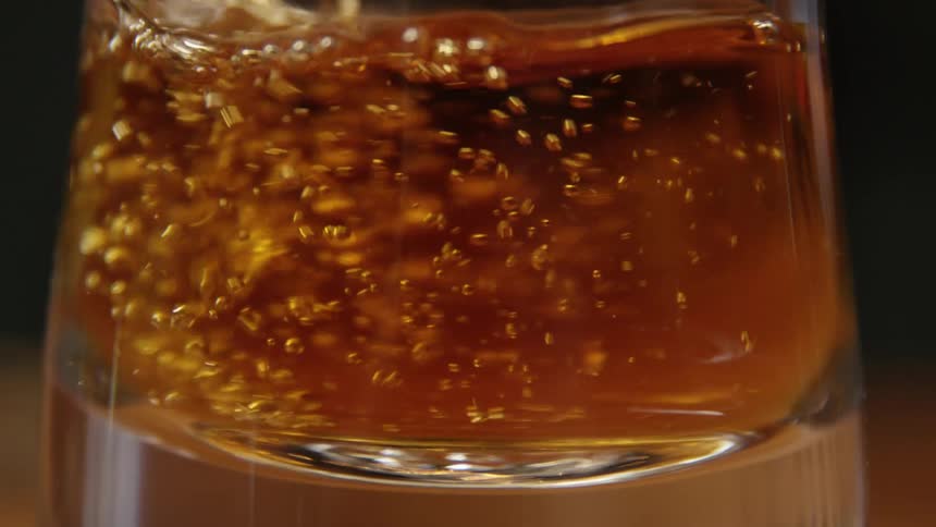 Liquid is poured into a glass