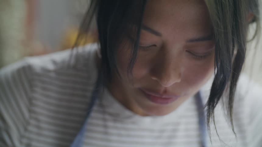 Close up of the face of a woman focused on something