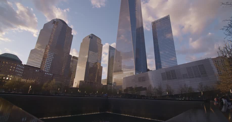 A pool in front of tall buildings