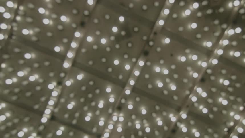 Many flashing light bulbs illuminate