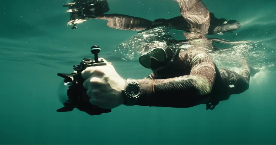 A clip of a cameraman filming underwater