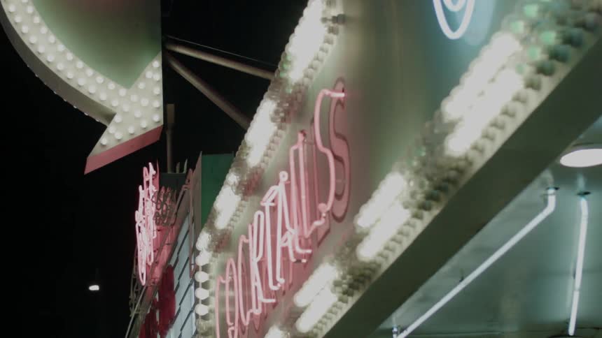 Neon lights and marquees lit up at night