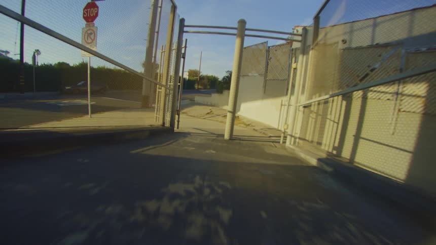 A view heading down the sidewalk on a sunny day