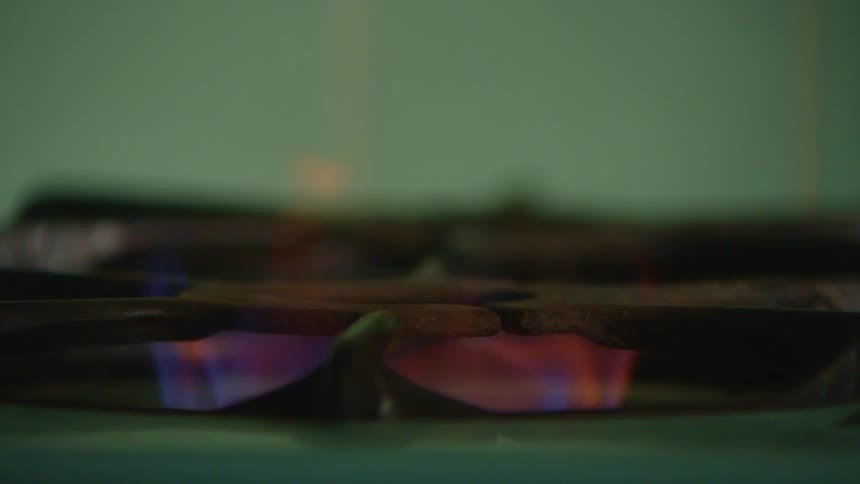 The stove is lit with a lighter