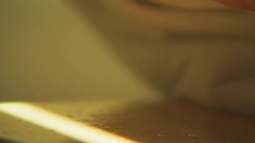A person wipes off the counter