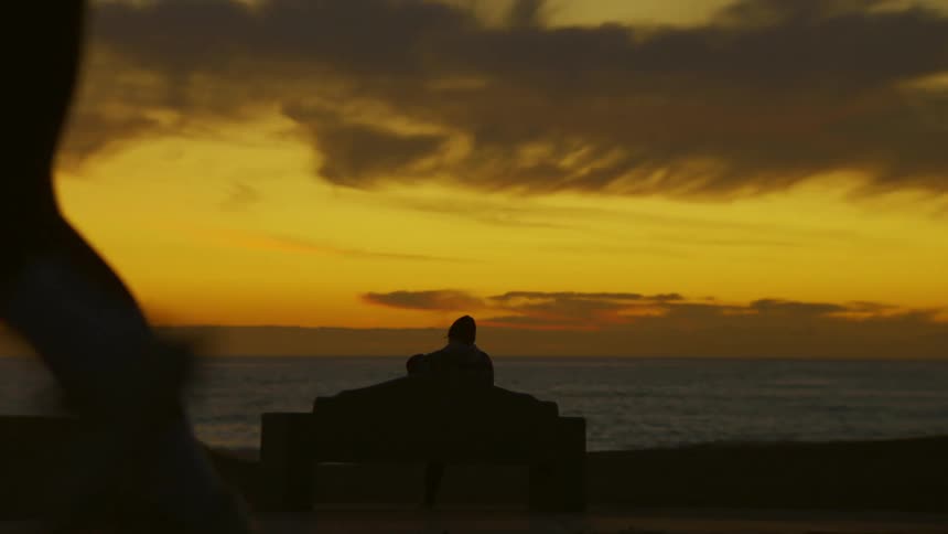 A clip of a man running by the beach side