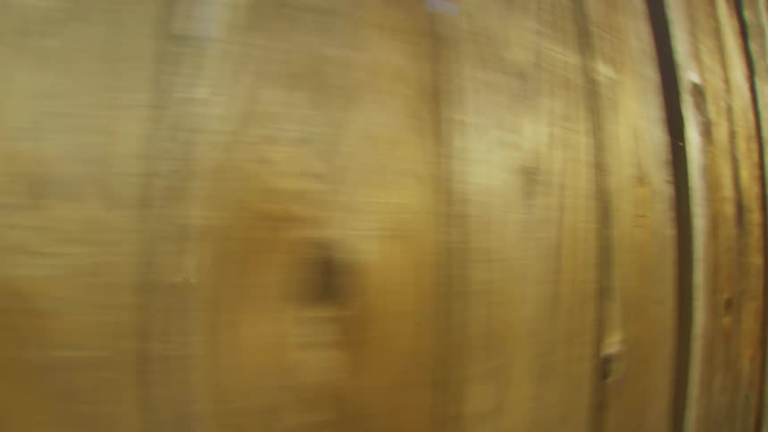 Pov moving to the right of a wood grained wall