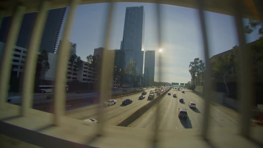 A highway with heavy traffic in the city during the day