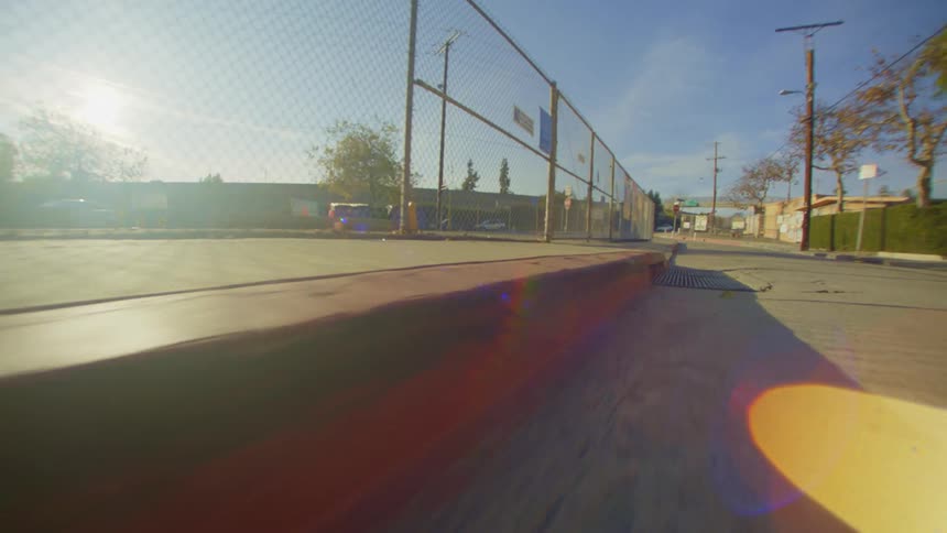 Frame of a street and view of the sidewalk of a city with a solar reflection