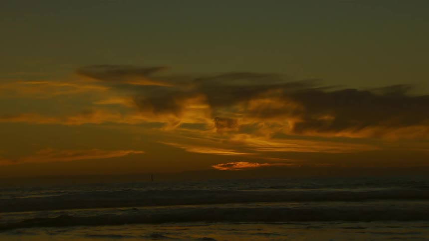 A region with an orange sky in the morning and a huge cloud in the sky