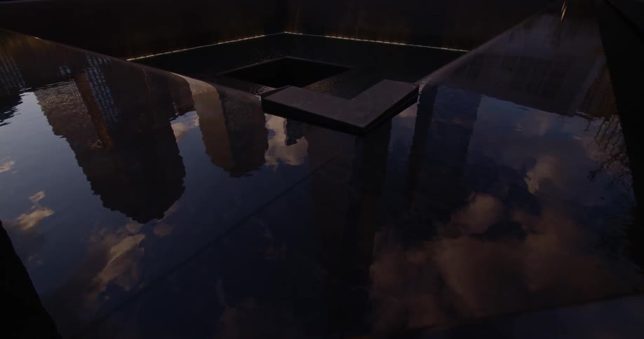 Water reflects city skyscrapers