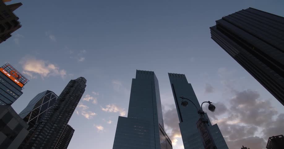 City skyscrapers stand against a blue sky