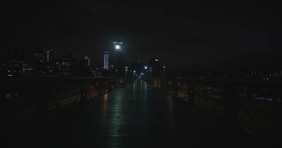 Walkway over a city freeway at night