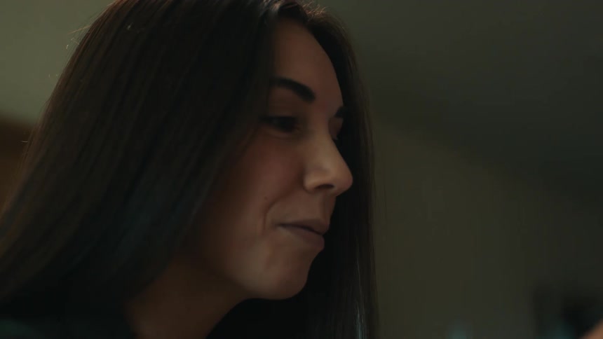 A beautiful woman sits and paints
