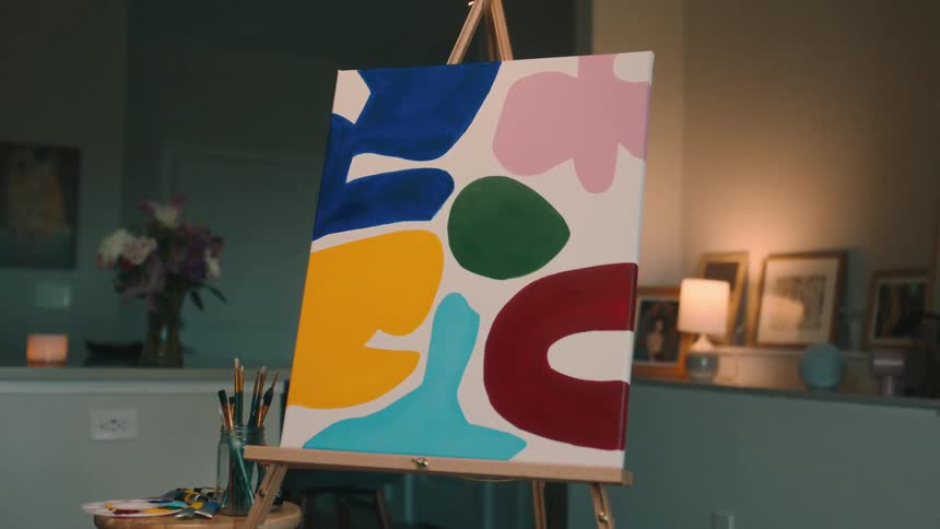 Colorful painted canvas in a room indoors