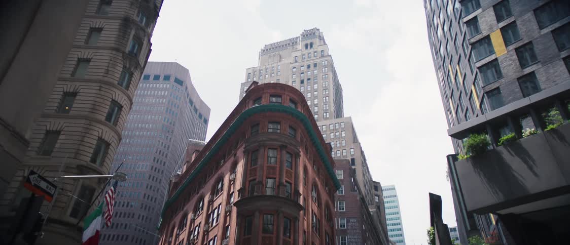 Panorama of large buildings of different sizes in the middle of a metropolis on a cloudy day