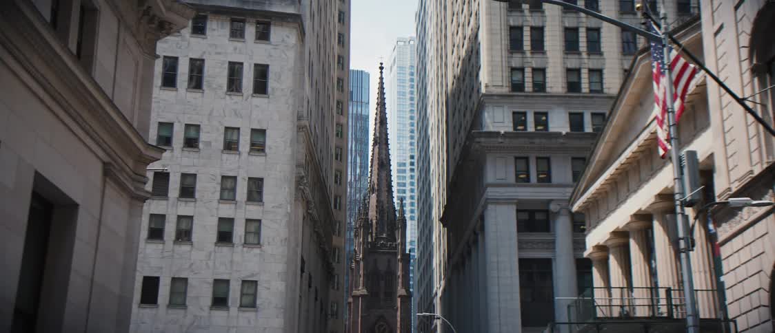 City buildings and flags during the day